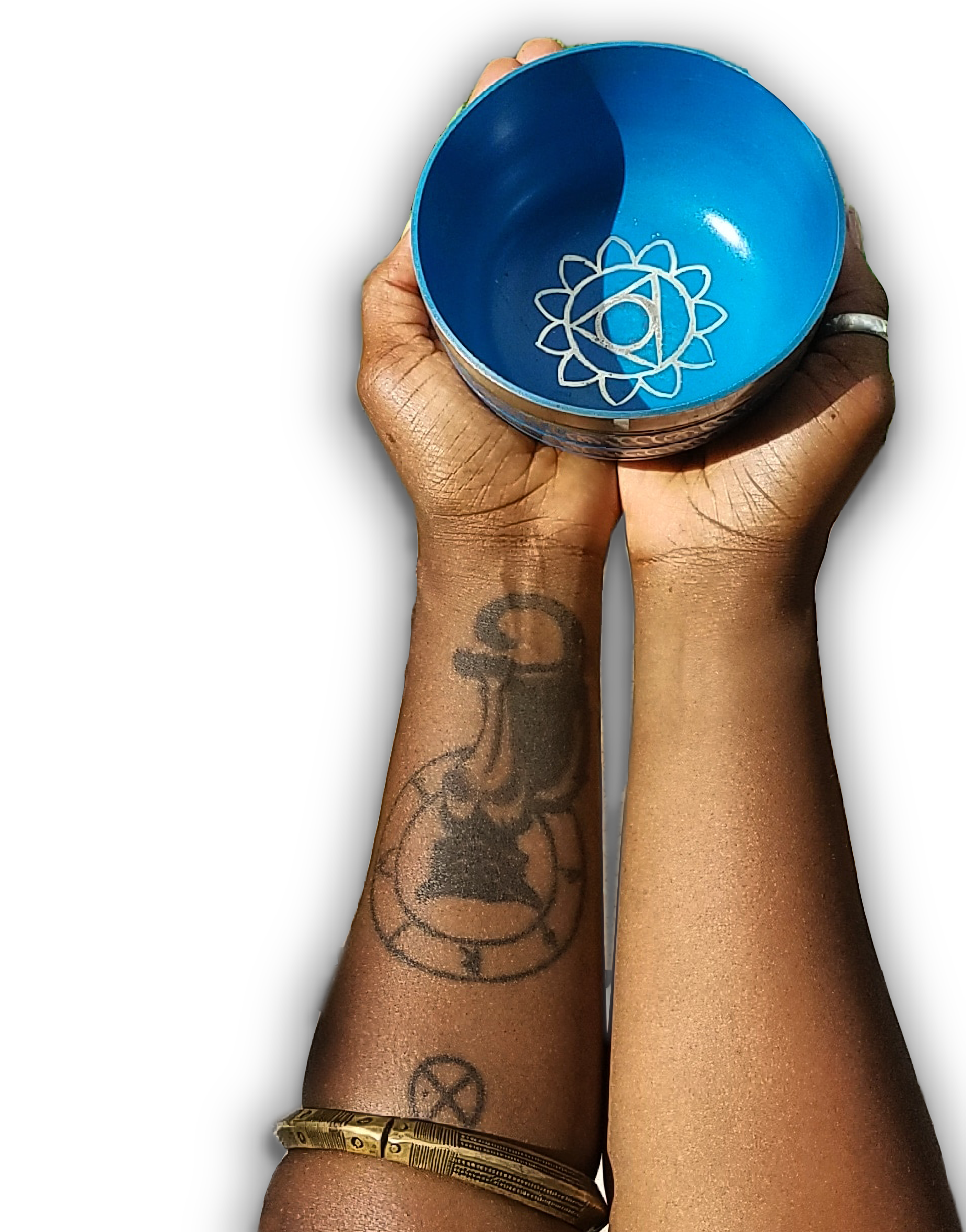SimoneJenifer's hands holding a blue enameled singing bowl